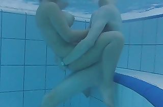 Teen 18+ duo is having sex underwater! Big tits meet big dick! The water is warm and they are so horny!!!